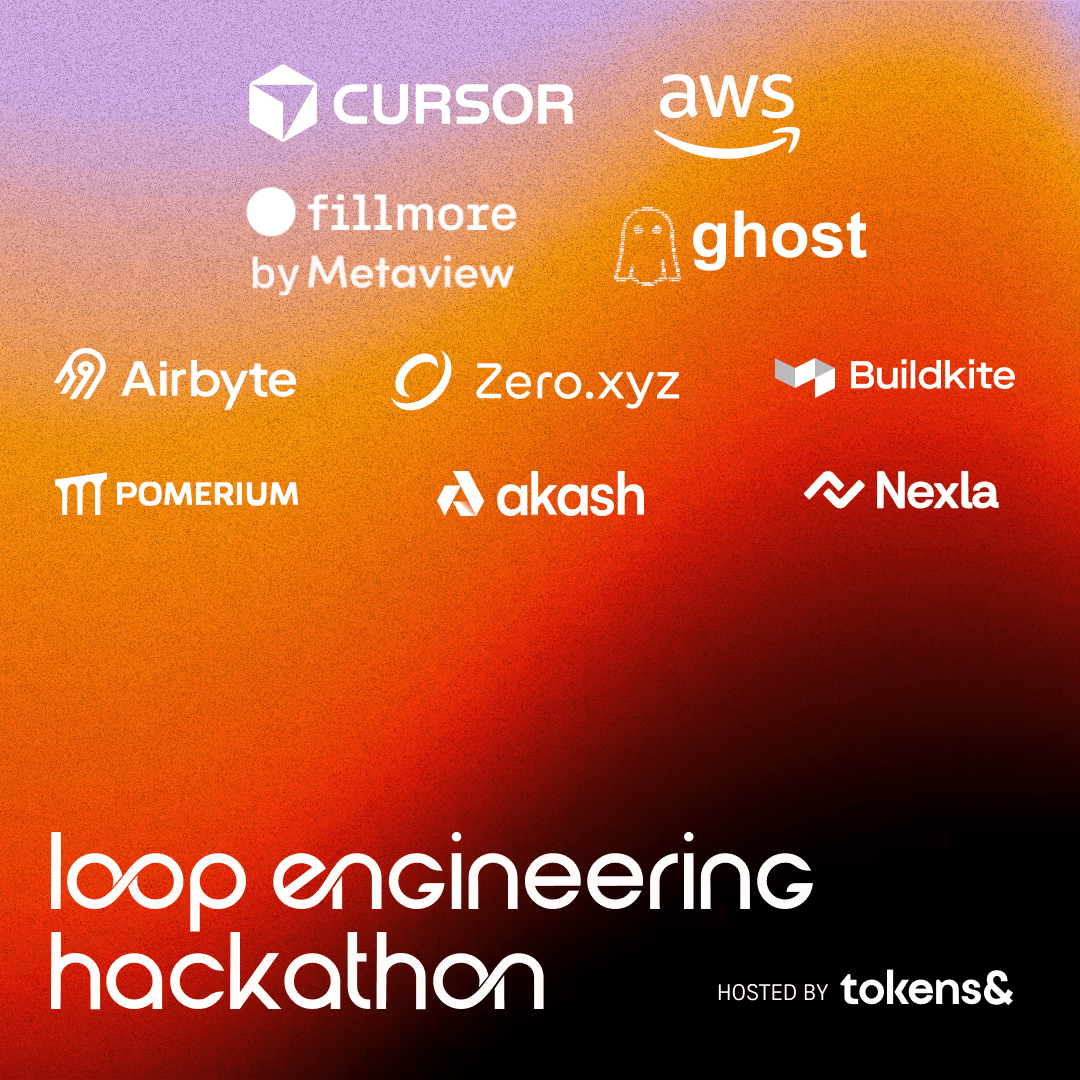 Developers building at a packed hackathon hosted in a partner workspace.